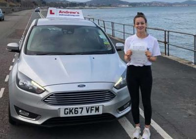 Mia with her driving instructors car in Old Colwyn