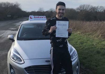 Ismail in Llandudno with his driving test pass certificate