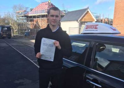 Joshu in Bangor with his driving lesson car.