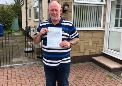 Anthony in Prestatyn with his driving test certificate.