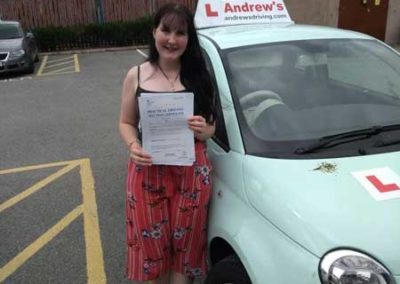 Rhian with her car in Rhyl after a first time pass