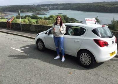 Lauren by Menai Bridge after passing her driving test in Bangor