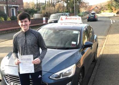 Evan with his driving test pass certificate.