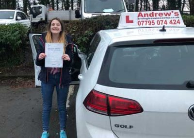 Hope from Colwyn Bay with her driving instructors car.