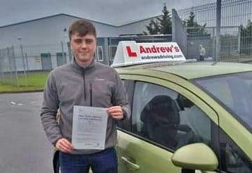 Harry at Bangor driving test centre with DVSA driving test pass certificate.