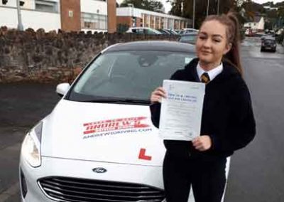 Jessica with a driving test pass certificate.