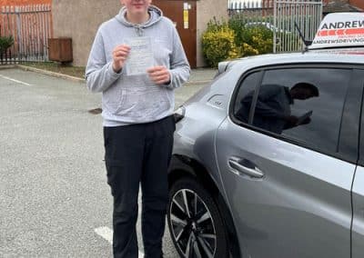 Corey with Carolines car at Rhyl Driving Test Centre