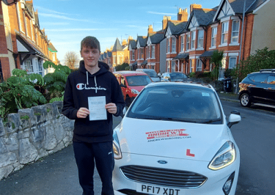 Isaac with Tom's Driving Instructor car